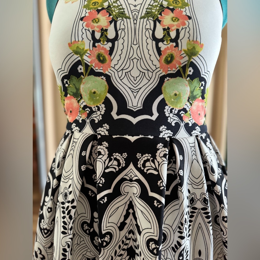 Elegant and versatile dress featuring a back zipper for easy wear.